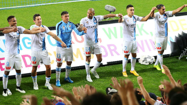 Melbourne City players celebrate their win over the Jets in Round 21.