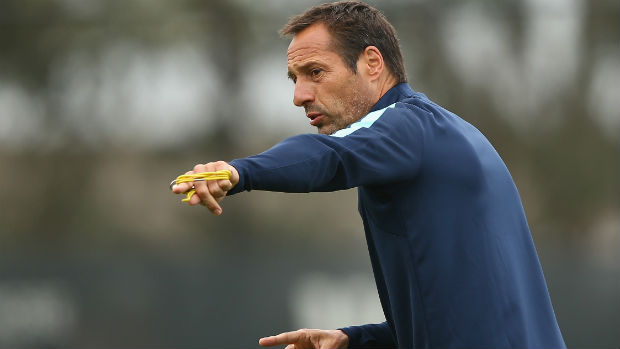 Melbourne City coach John van't Schip gives instructions on the training ground.