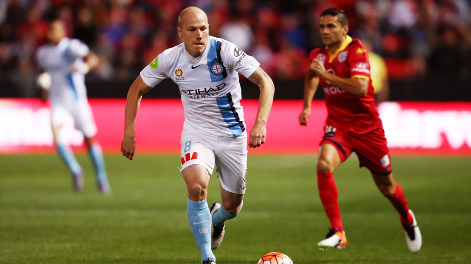 City star Aaron Mooy controls the ball ahead of Reds midfielder Marcelo Carrusca.