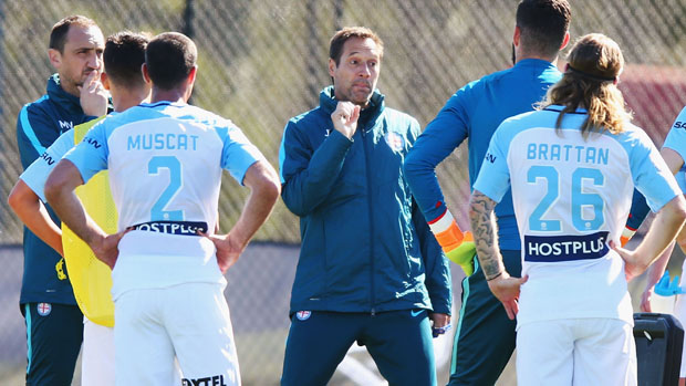 Melbourne City boss John van't Schip gives instructions to his players during a training session.